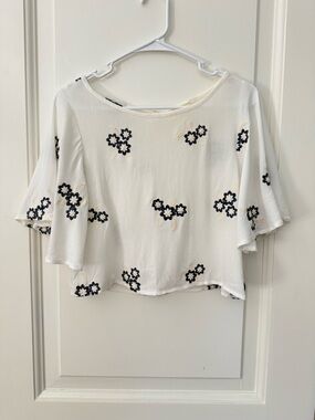Caution To The Wind Ivory Cropped Flutter Sleeve Top with Navy Floral Embroidery
